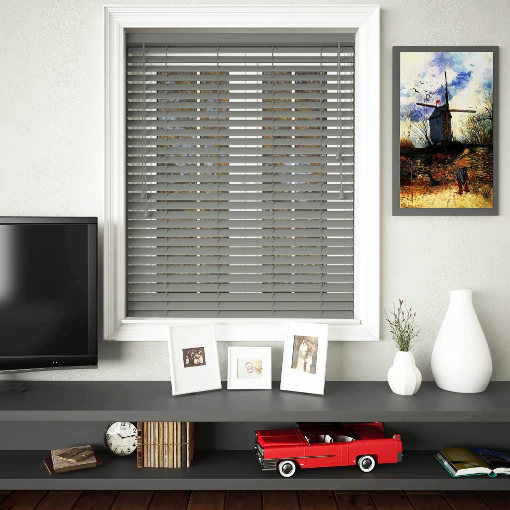 An image showing a dark grey wooden blind fitted into a striking office space