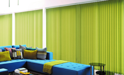 Bright green vertical blinds in a living room. 